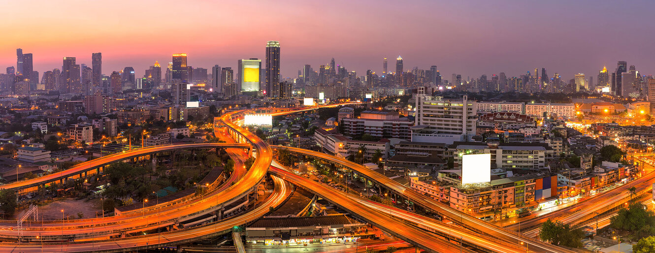 Panorama view of Modern office buildings, condominium in big city downtown with Motorway, Expressway, Freeway the infrastructure for transportation in modern city, urban view at twilight time