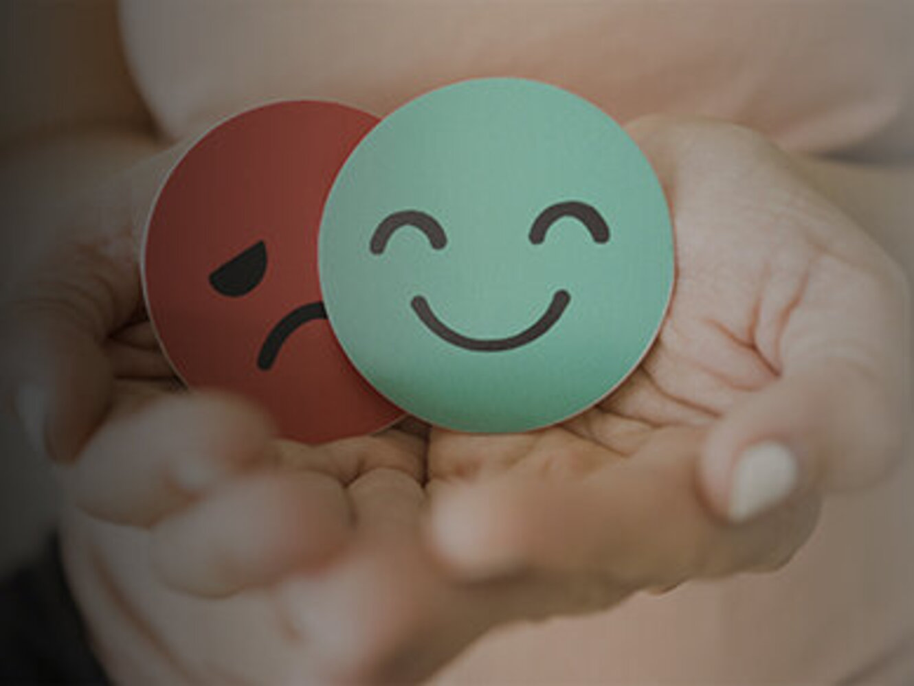 Middle age woman hands holding sad face hiding behind happy face, bipolar and depression, mental health, midlife crisis concept