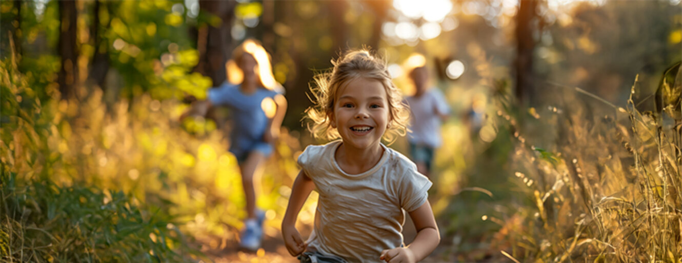 A young girl runs away from her friends in the forest at the golden hour in a spirited game of tag. AI generated