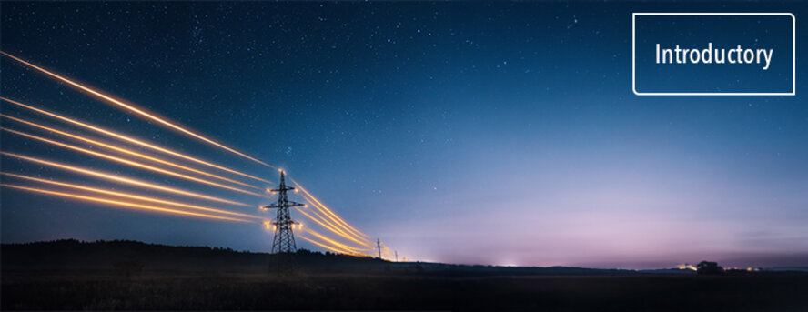 Electricity transmission towers with orange glowing wires the starry night sky. 