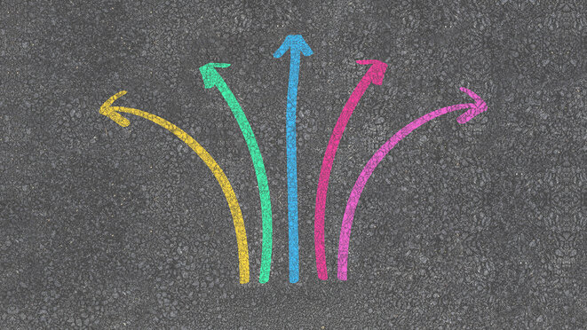 colorful direction arrow choices, painted with chalk on asphalt