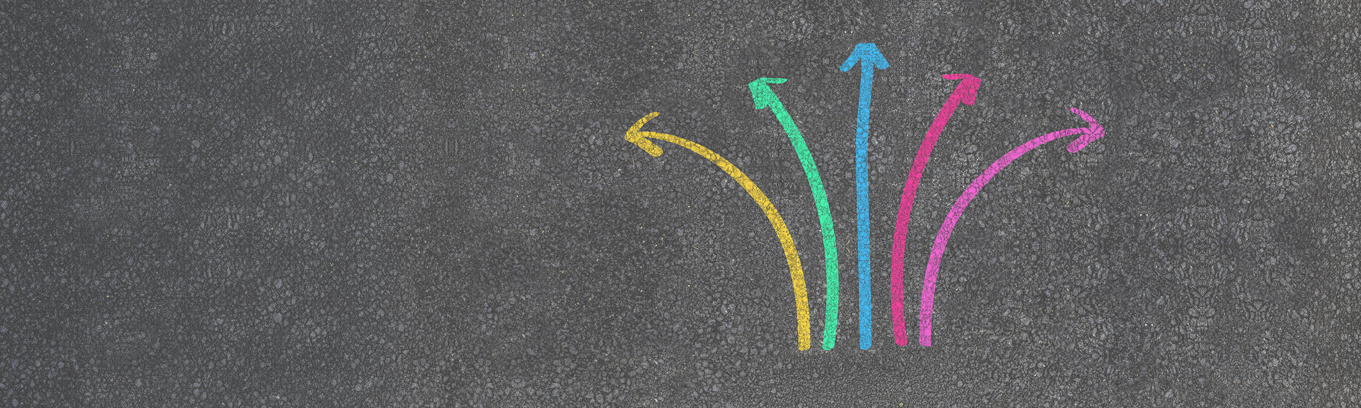 colorful direction arrow choices, painted with chalk on asphalt