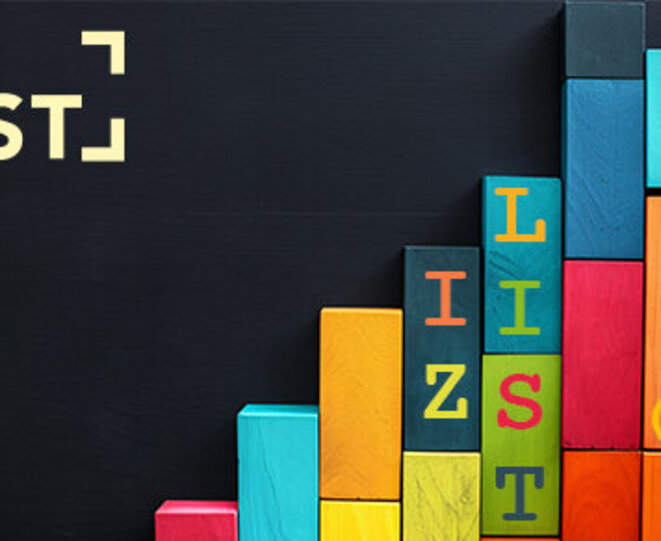 Colorful wooden blocks stacked in a pattern against a dark background creating a playful and structured 