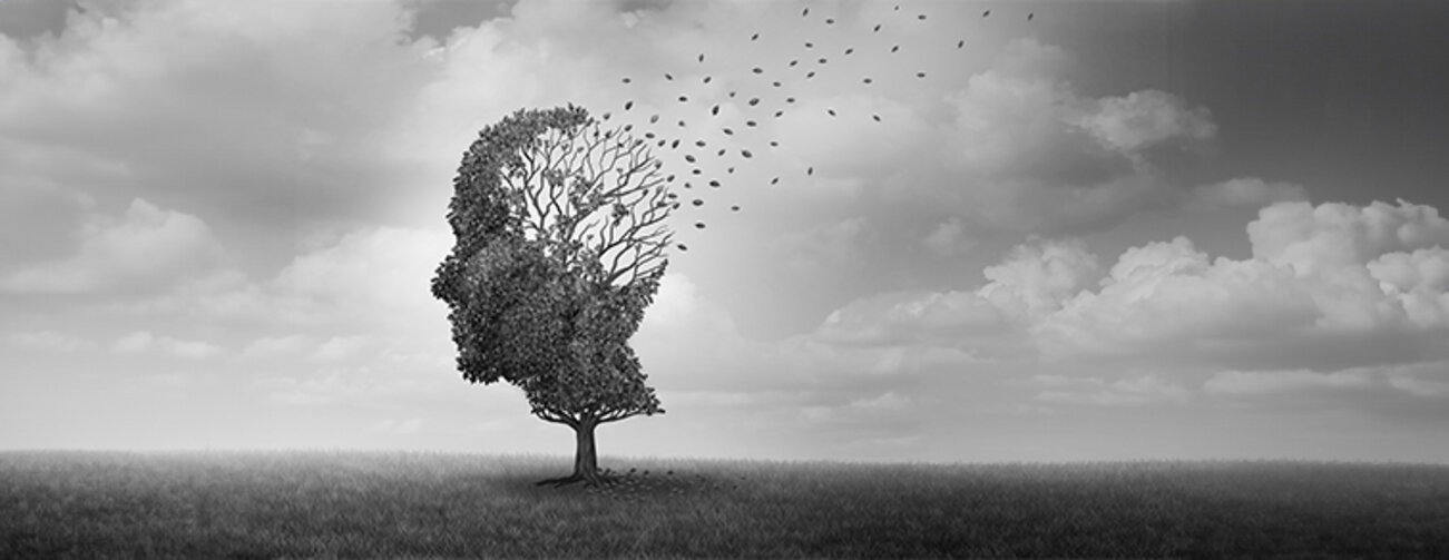 Alzheimer Disease concept - back and white image of a tree in form of a head with the leaves flying away in the back